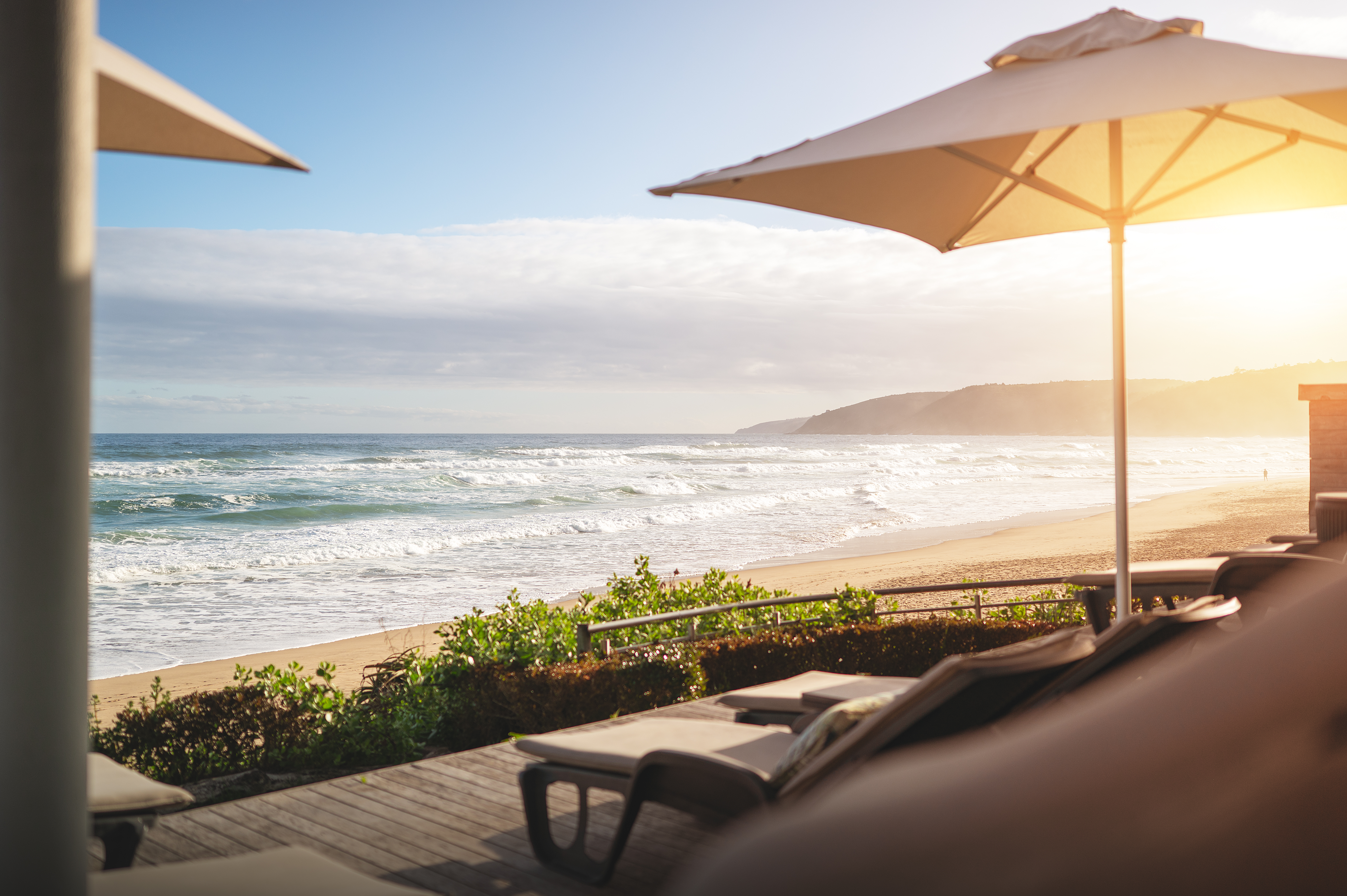 The pool deck and beach house at Beach Villa Wilderness