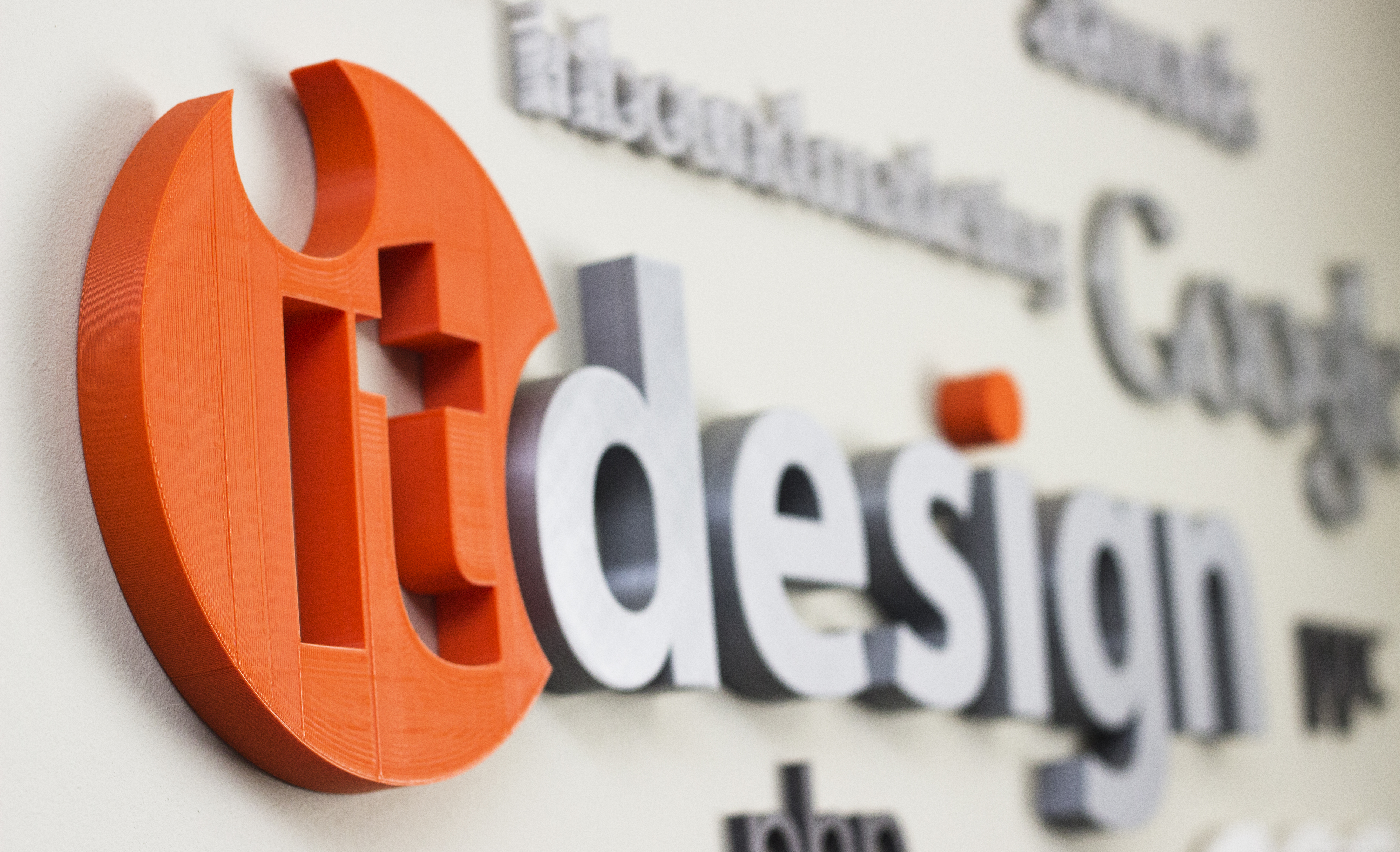 The 3D-printed IT Design mark on the studio wall in Gqeberha (Port Elizabeth)